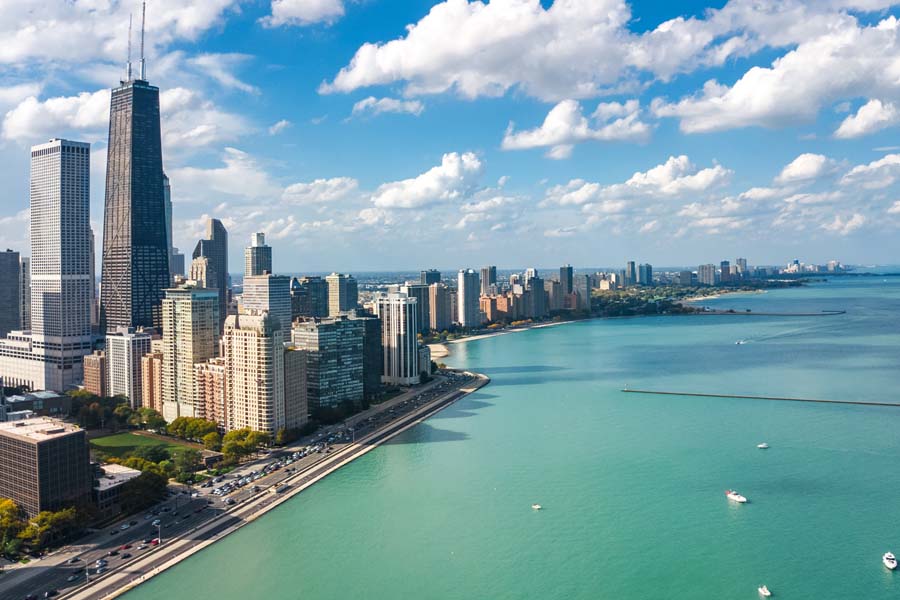 About Our Agency - Chicago Skyline Looking Over Lake Michigan on a Summer Day